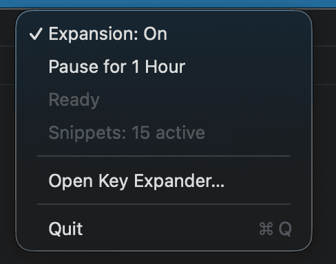 The Key Expander menu bar dropdown on macOS. Expansion: On is ticked, then a Pause for 1 Hour command, then the status lines Ready and Snippets: 15 active, then Open Key Expander and Quit.